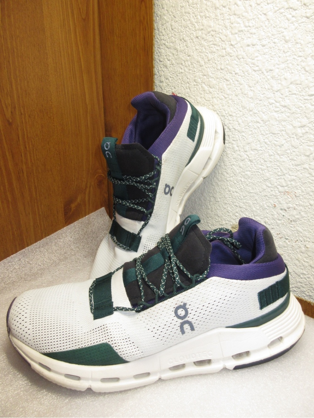 On Running women’s White Sneakers with Green and Purple Accents